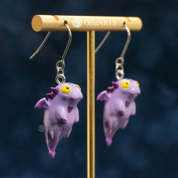 Earrings with a cute purple dragon