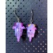 Earrings with a cute purple dragon