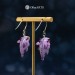 Earrings with a cute purple dragon