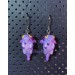 Earrings with a cute purple dragon