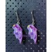 Earrings with a cute purple dragon