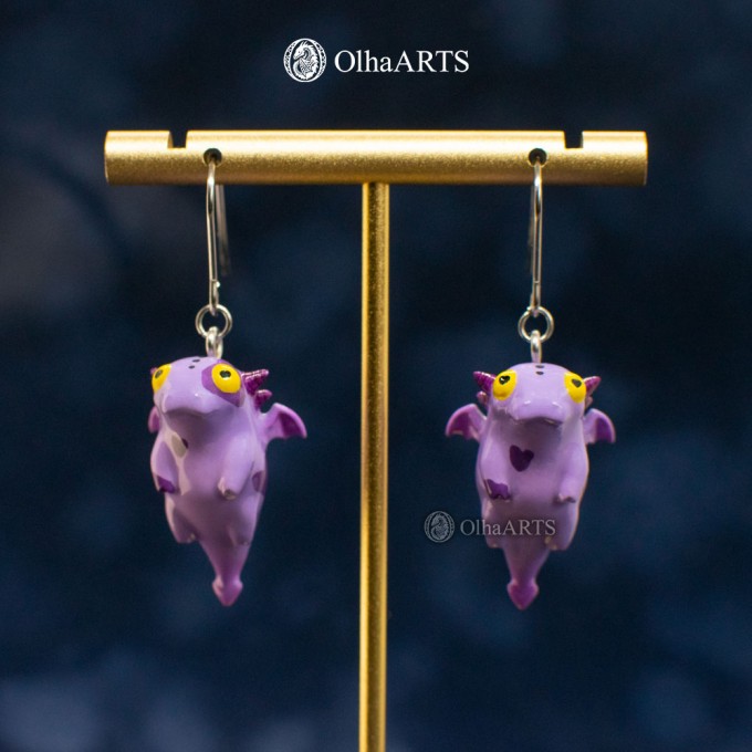 Earrings with a cute purple dragon