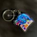 Keychain blue dragon with comic book