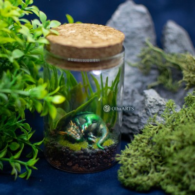 Little jar with a sleeping dragon, fantasy terrarium.